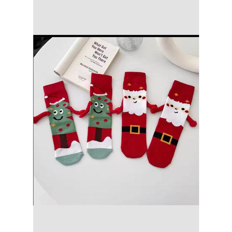 Hand Holding Christmas Socks